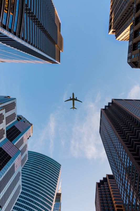 Airplane over city